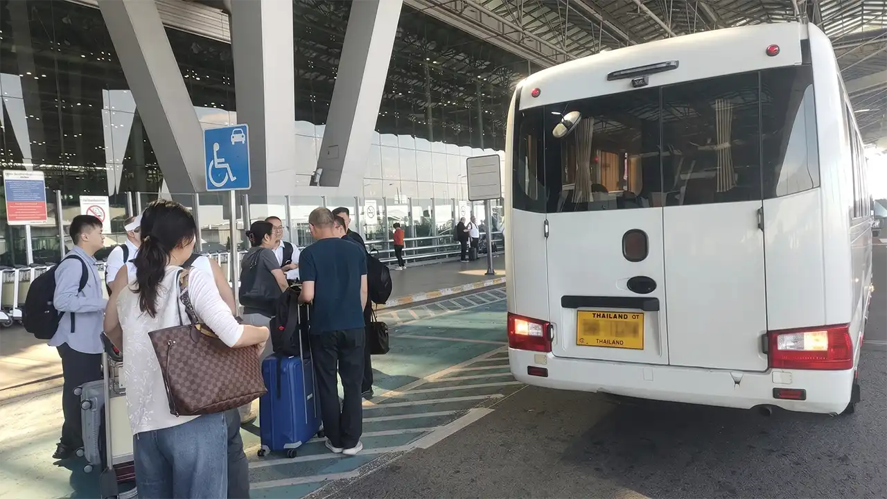 Toyota Coaster at Suvarnabhumi Airport for group airport transfer Bangkok